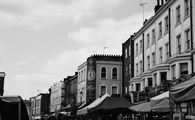 Black and white photo of shops in Notting Hill, London