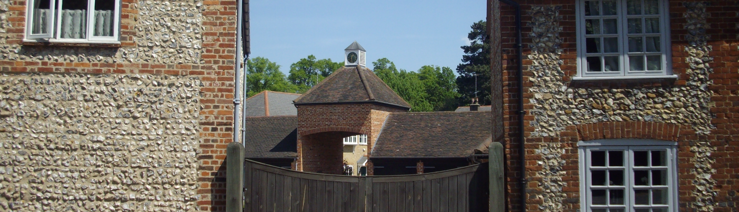 Chorleywood view of clock tower through period buildings