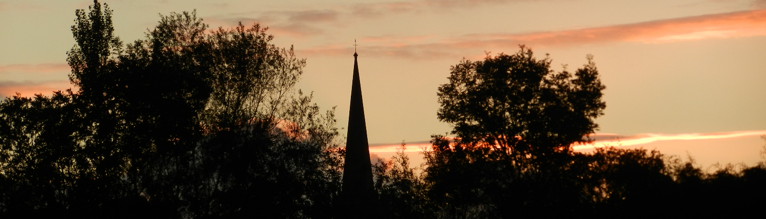 Church spire silhouette in sunset