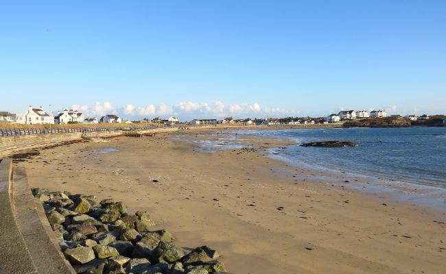 Trearddur beach with view of seaside properties